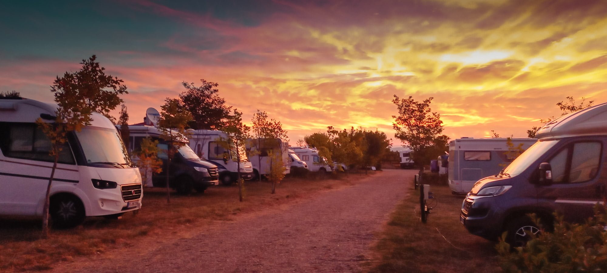 Camper vans in the early morning sunrise.